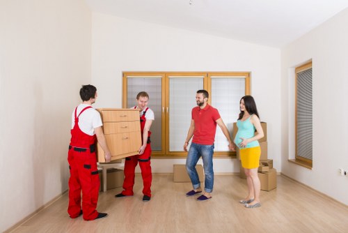Employee moving goods with proper manual handling precautions